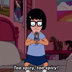 A Cartoon Character Holding A Gun With The Words Too Spicy Too Spicy Below Her GIF