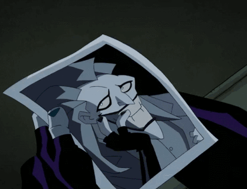 A Cartoon Character Holding A Piece Of Paper With A Joker Face On It GIF