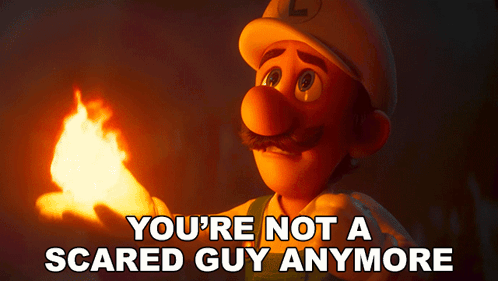 A Cartoon Character Holding A Torch With The Words " You 'Re Not A Scared Guy Anymore " Above Him GIF