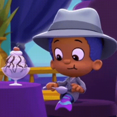 A Cartoon Character In A Hat Sits At A Table With A Bowl Of Ice Cream GIF