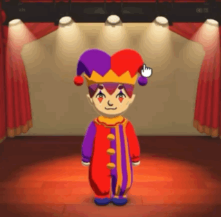 A Cartoon Character In A Jester Costume Is Standing On A Stage In Front Of A Red Curtain . GIF