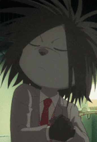 A Cartoon Character In A Suit And Tie Holds A Black Object GIF