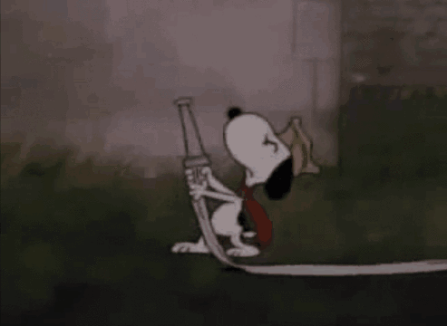 A Cartoon Character Is Being Sprayed With Water While Standing In The Rain . GIF