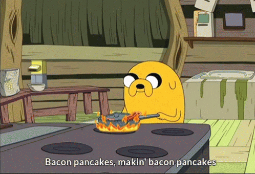 A Cartoon Character Is Cooking Bacon Pancakes On The Stove GIF