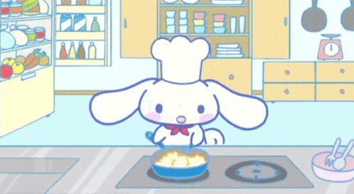 A Cartoon Character Is Cooking Food In A Kitchen . GIF