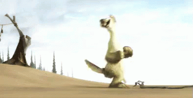 A Cartoon Character Is Doing A Handstand On A Sandy Hill . GIF