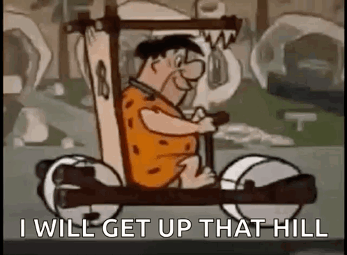 A Cartoon Character Is Driving A Car With The Words `` I Will Get Up That Hill '' Written On It . GIF