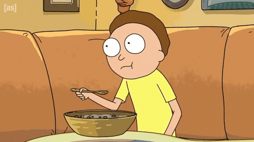 A Cartoon Character Is Eating A Bowl Of Cereal With The Letters A And S On The Bottom Right GIF