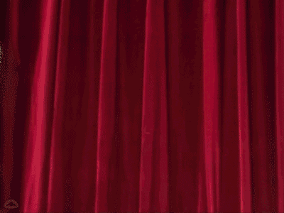 A Cartoon Character Is Holding A Chainsaw In Front Of A Red Curtain .. GIF