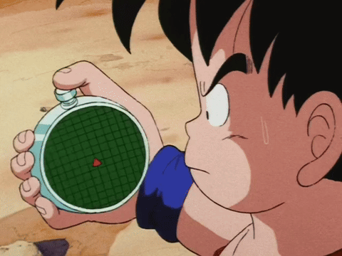 A Cartoon Character Is Holding A Device With A Red Arrow Pointing To The Center GIF
