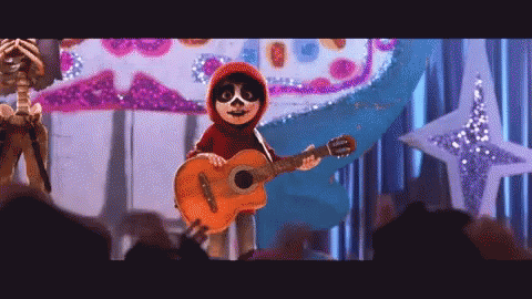 A Cartoon Character Is Holding A Guitar On A Stage . GIF