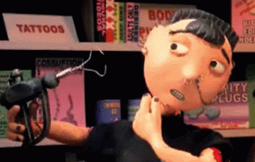 A Cartoon Character Is Holding A Gun In Front Of A Sign That Says Tattoos On It GIF