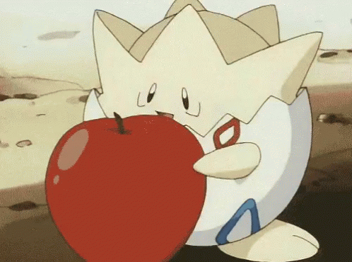 A Cartoon Character Is Holding A Large Red Apple In Its Mouth . GIF