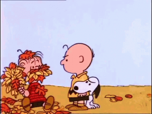 A Cartoon Character Is Holding A Lollipop In A Field . GIF