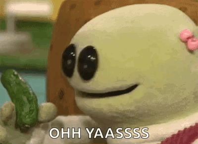 A Cartoon Character Is Holding A Pickle And Says Ohh Yaasssss . GIF