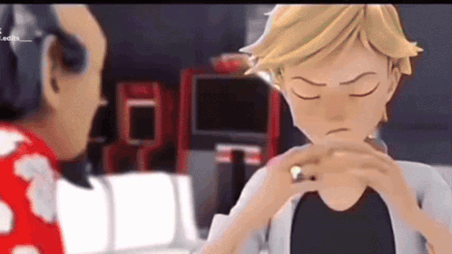 A Cartoon Character Is Holding A Ring In His Hand While Talking To Another Character . GIF