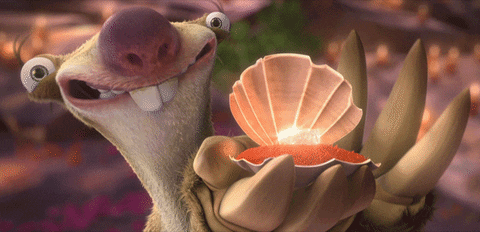 A Cartoon Character Is Holding A Sea Shell In His Hand GIF