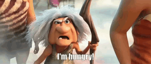 A Cartoon Character Is Holding A Stick And Saying I 'M Hungry ! GIF