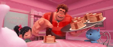 A Cartoon Character Is Holding A Tray Of Pancakes And Pointing At Them GIF