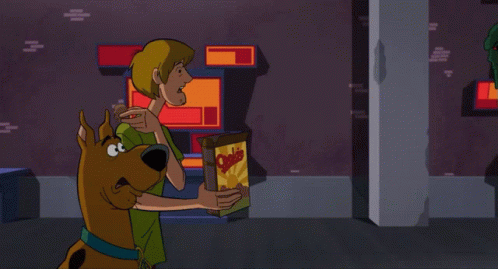 A Cartoon Character Is Holding Something In His Hand And Screaming GIF