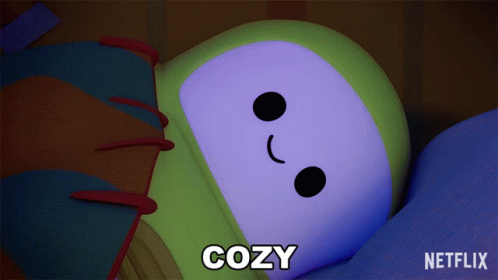 a cartoon character is laying down with the word cozy below it