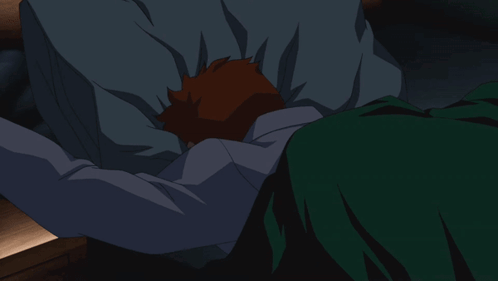 A Cartoon Character Is Laying In A Bed With His Arms Outstretched GIF