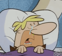 A Cartoon Character Is Laying In Bed Crying With A Tear Coming Out Of His Nose GIF