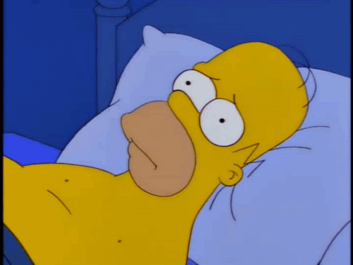 A Cartoon Character Is Laying In Bed With An Alarm Clock That Says 1:00 GIF