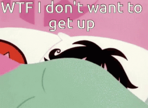 A Cartoon Character Is Laying In Bed With The Words " Wtf I Don 'T Want To Get Up " GIF