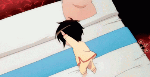 A Cartoon Character Is Laying On A Bed With A Pillow GIF