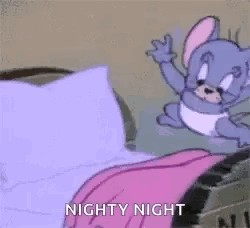 A Cartoon Character Is Laying On A Bed With A Pink Blanket On . GIF