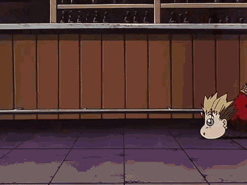 A Cartoon Character Is Laying On The Floor With His Head In The Air . GIF