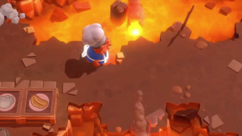 A Cartoon Character Is Laying On The Ground In Front Of A Large Fire GIF