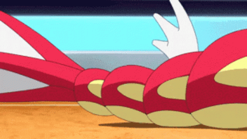 A Cartoon Character Is Laying On The Ground GIF