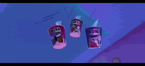 A Cartoon Character Is Laying On The Ground Reaching For A Cup Of Rumi GIF