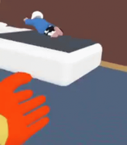 A Cartoon Character Is Laying On Top Of A Bed In A Room . GIF