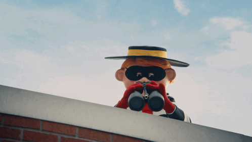 A Cartoon Character Is Looking Through Binoculars On A Ledge GIF
