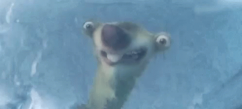 A Cartoon Character Is Making A Funny Face While Standing In Ice . GIF