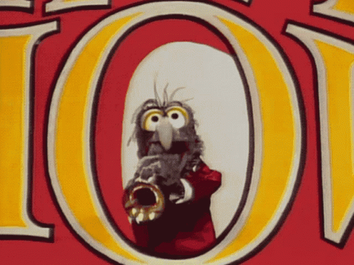 A Cartoon Character Is Playing A Trumpet In Front Of A Red And Yellow Sign That Says 101 GIF