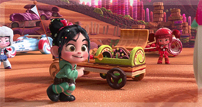 A Cartoon Character Is Pushing A Cart Full Of Candy In A Candy Land GIF