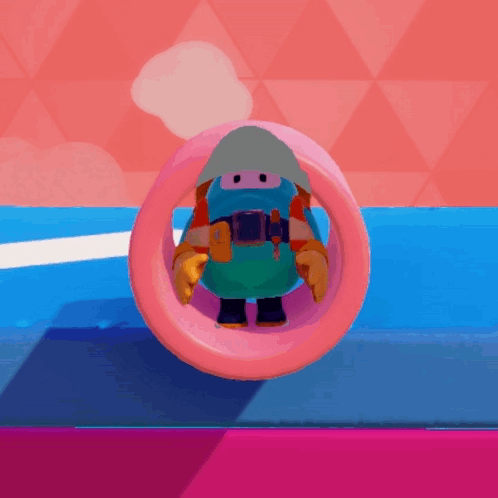A Cartoon Character Is Riding Through A Pink Ring On A Blue Surface . GIF