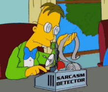A Cartoon Character Is Sitting At A Desk With A Sarcasm Detector GIF