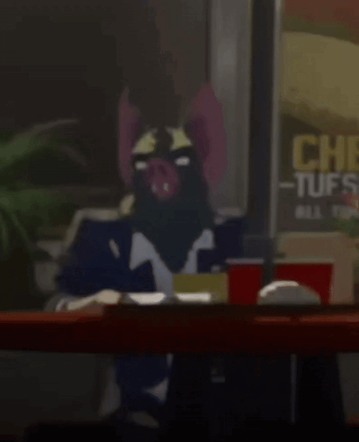 A Cartoon Character Is Sitting At A Table In Front Of A Sign That Says Chick-Fil-A Tuffs GIF