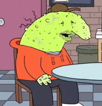 A Cartoon Character Is Sitting At A Table Wearing An Orange Hoodie And Hat GIF