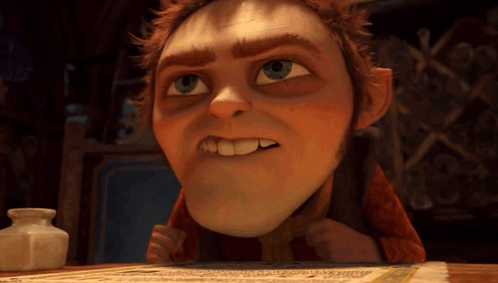 A Cartoon Character Is Sitting At A Table With A Piece Of Paper GIF