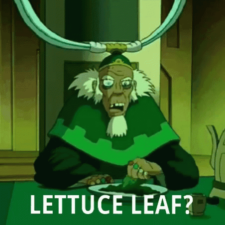 A Cartoon Character Is Sitting At A Table With A Plate Of Lettuce And The Words `` Lettuce Leaf '' . GIF