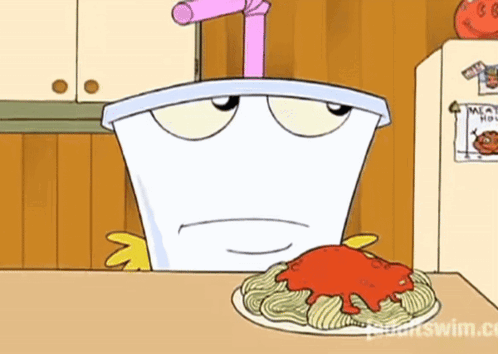 Cartoon Character Sitting At Table With Spaghetti GIF