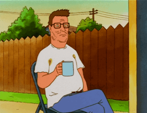 a cartoon character is sitting in a chair holding a cup