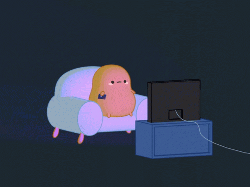 A Cartoon Character Is Sitting In A Chair Watching A Tv GIF