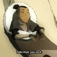 A Cartoon Character Is Sitting In A Chair With The Words `` Take That , You Rock '' Written On The Bottom . GIF